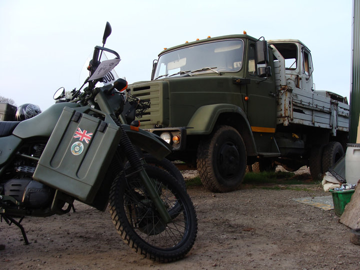 A Harley-Davidson MT350 in front of a Russian military truck