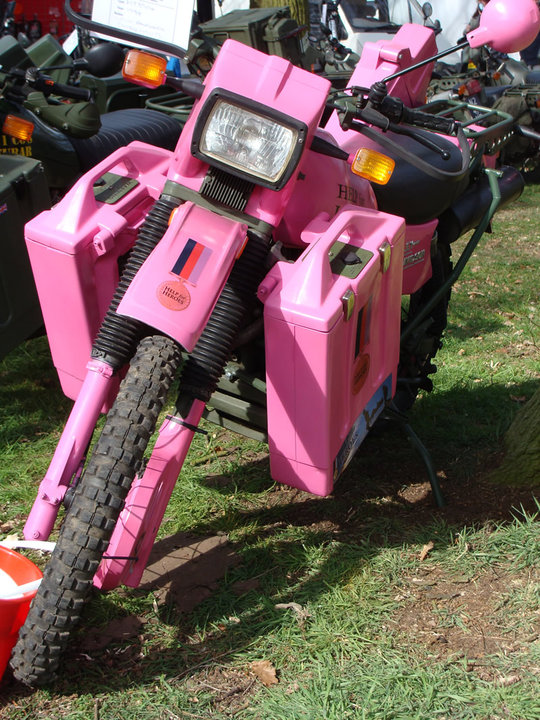 A pink Harley-Davidson MT350 displayed at a show